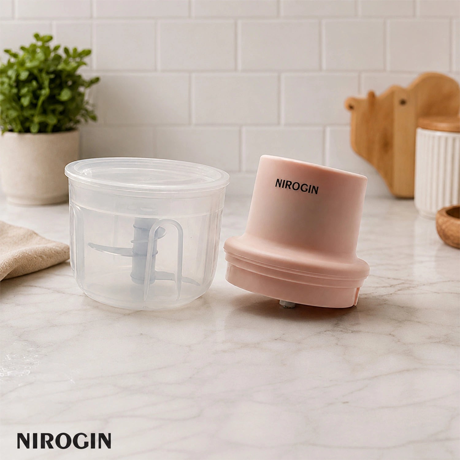 Nirogin Rechargeable Vegetable Chopper parts, 250ml bowl and lid on kitchen countertop, ideal for quick chopping.
